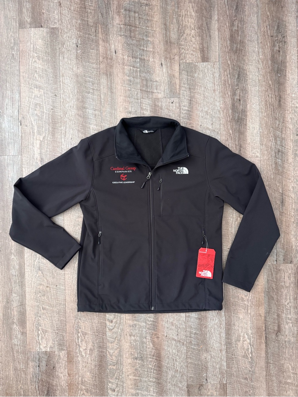The North Face Men's Black Softshell Jacket with Red Logo Tag